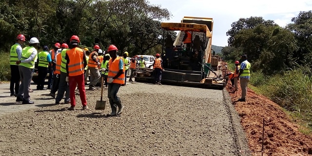 Asphalt paving crew laying a wearing course